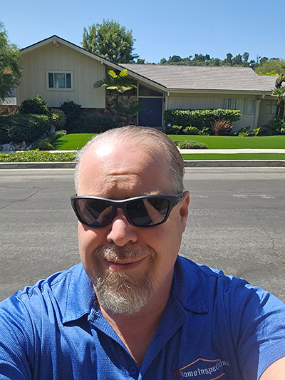 Home Inspector in front of the Brandy Bunch house